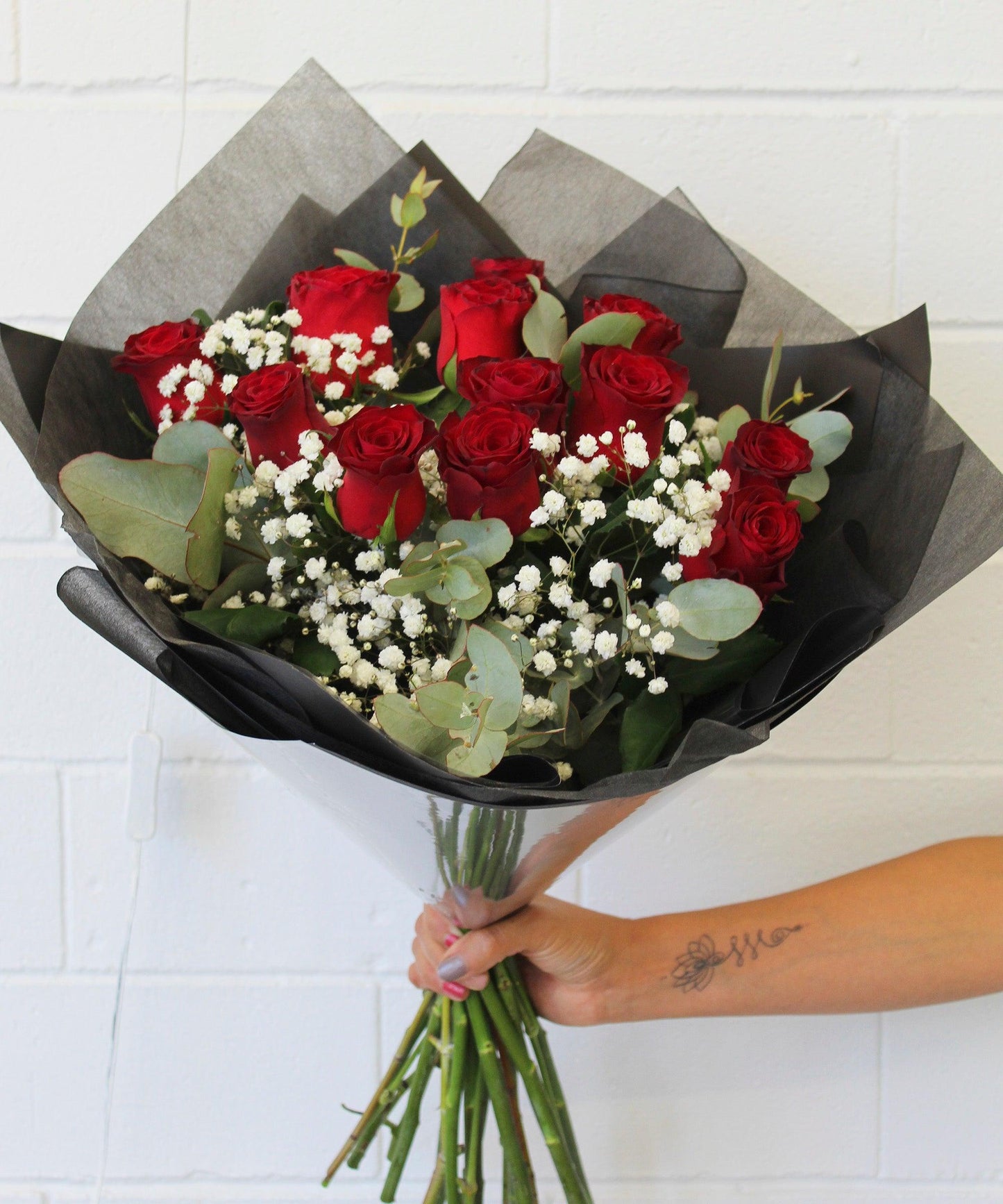 Rose-Garden-Red-Roses-mixed-with-seasonal-greenery-and-baby's-breath